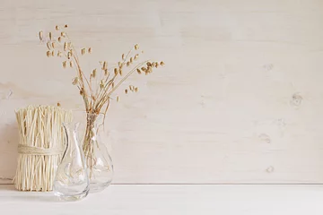 Foto op Canvas Soft home decor of  glass vase with spikelets and stalks on white wood background. Interior. © finepoints