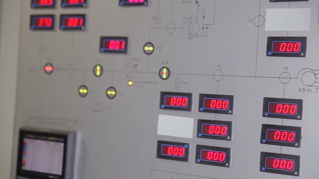 Industrial control panel with red digits on the display showing parameters. Slider shot.