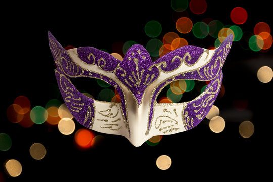 Carnival Halloween mask on bokeh background. Halloween holiday c