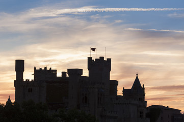 Fototapeta premium Silhouette of the castle of Olite, Navarra, Spain, during sunset