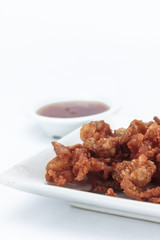 Fried chicken skin on white background