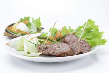 Sour pork and vegetable snacks in Thailand on white background