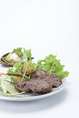 Sour pork and vegetable snacks in Thailand on white background