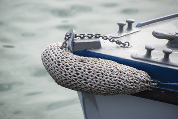 Vintage style picture of beautiful sail boat details. Rope, hull
