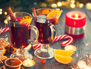 Christmas hot mulled wine with cinnamon stick, slices of orange and spices