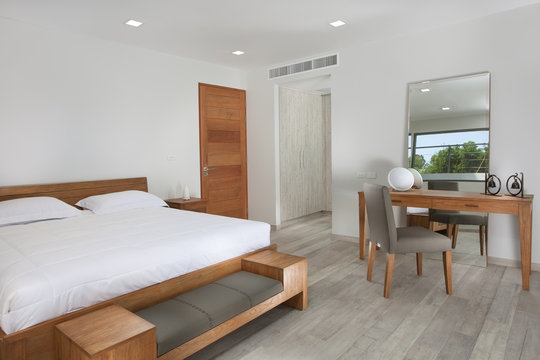 Panoramic view of nice white stylish modern bedroom