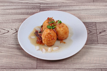 Fried hard-boiled eggs with tamarind sauce call as Khai Luk Keoi in Thai ,which mean egg gift  from son-in-law , is tasty as sweet sour and little spicy topped crispy skin of boiled egg. 
