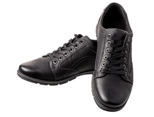 Pair of black everyday male shoes on white background.