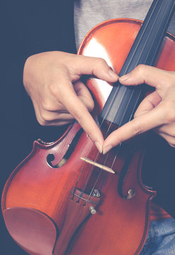 music lover, female hand sign on classical violin