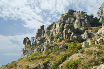 Fototapeta na wymiar Stone idols of the mountain South Demerdzhi on a background of clouds. Crimea.