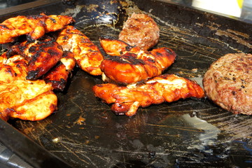 The concept of sunny summer days with Golden chicken & sizzling burgers on a tray ready to eat