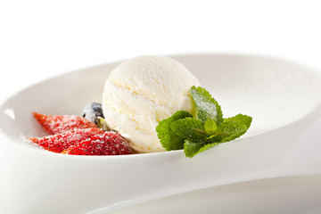 Ice Cream Garnished with Strawberry and Mint