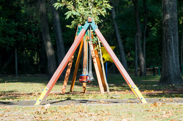 Colorful swings in lateral view in a park