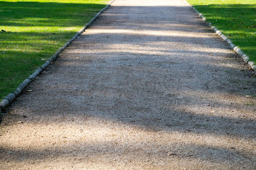 Road with shades on it in a park