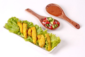 Charcoal boiled pork satay on butcher served , home made in big size, served with Thai cucumber chili sauce ( Ar Jad in Thai) and nut sauce are popular Asia cuisine.