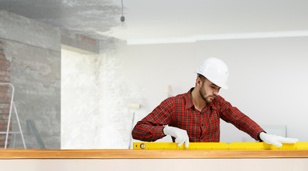 Builder man with level . Mixed media