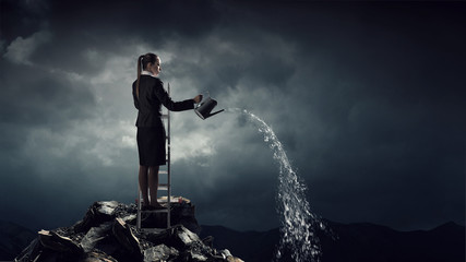 Obraz premium Businesswoman on ladder top . Mixed media