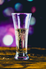 Glass of light beer with bubbles