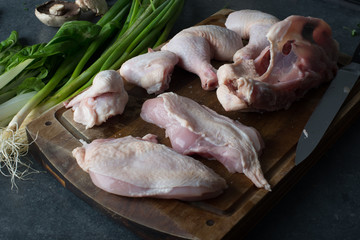 Raw Chicken Portions with greens  ready for cooking