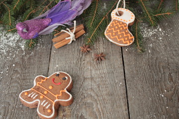 Gingerbread, Christmas ornament, fir tree, snow on wooden background , cinnamon, star anise