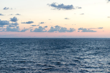 Fototapeta premium Scenic view of peaceful sea just before the sunset the sky is filled with clouds