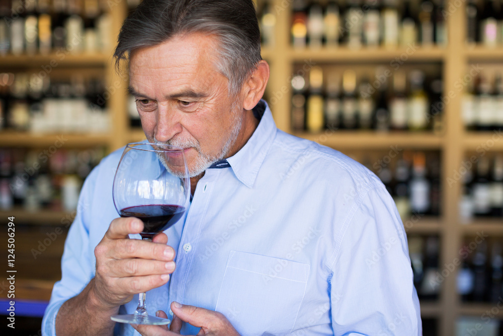 Wall mural Man tasting wine
