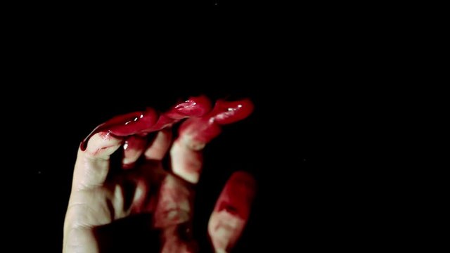 Bloody hand on window glass deep dark background