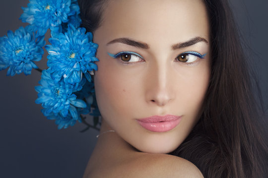 Woman Beauty Portrait With Blue Flowers