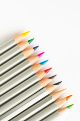 Colored pencils on white background