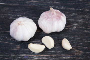 Garlic on a dark wooden background