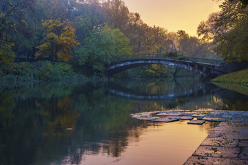 wonderful, colorful sunrise in autumnal park