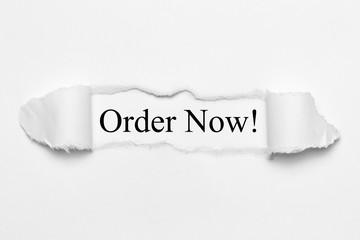 Fototapeta premium Order Now! on white torn paper