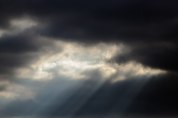 a beam of light from a dark sky