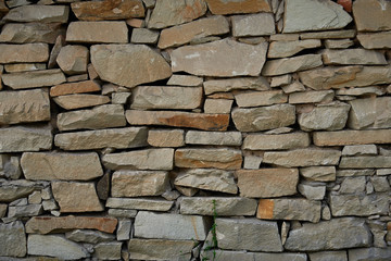 A fragment of a wall of sandstone