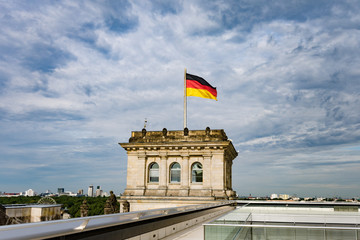 Fototapeta na wymiar German Reichstag in Berlin, Germany, with national flag, vintage filtered