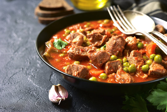 Veal stewed with vegetables in tomato sauce.