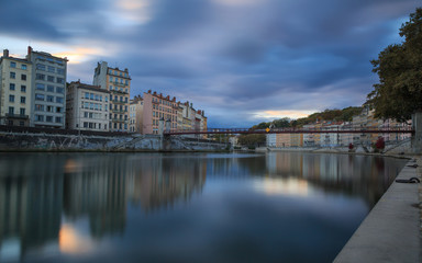 Fototapeta na wymiar Cloudcover above the Saone river and .Passerelle Saint-Vincent in Lyon during sunset.