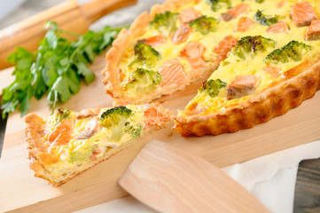 delicious pie with salmon and broccoli