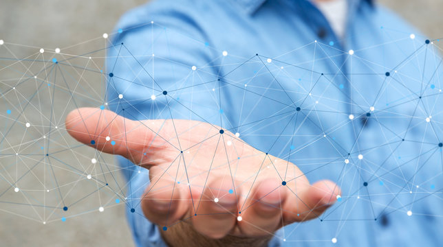 Businessman holding digital data network in his hand