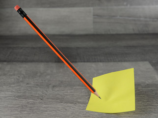 sticky notes and pencil  questions or decision making concept