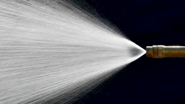 Spray of water from a atomizer high pressure. Background industry.