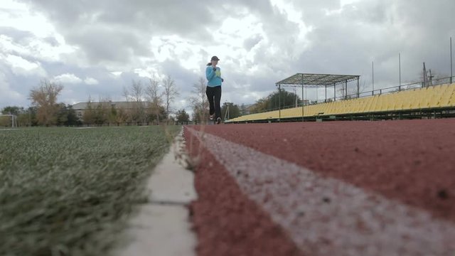 the athlete runs the stadium