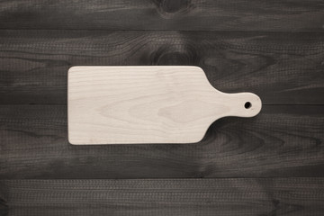 cutting board on wooden table