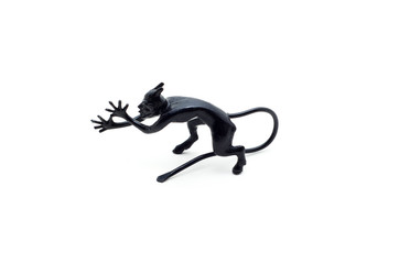 Fototapeta premium Metal devil figurine in a sneering posture isolated on white background.
