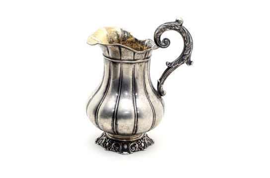 Antique Silver Jug Isolated On A White Background.