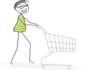 Un homme pousse un chariot pour faire ses courses