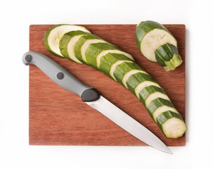 sliced zucchini with organic flowers on chopping board