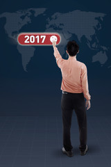 Entrepreneur presses virtual button with 2017