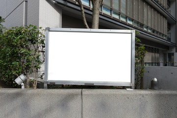 Large blank billboard on a street wall, banners with room to add your own text