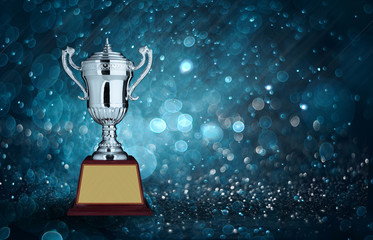abstract silver trophies with blue bokeh lighting. copy space re